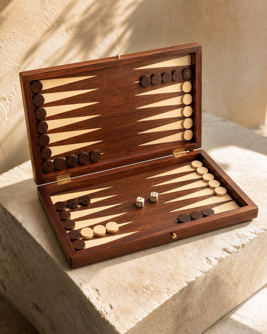 Open rosewood travel backgammon board with playing pieces
